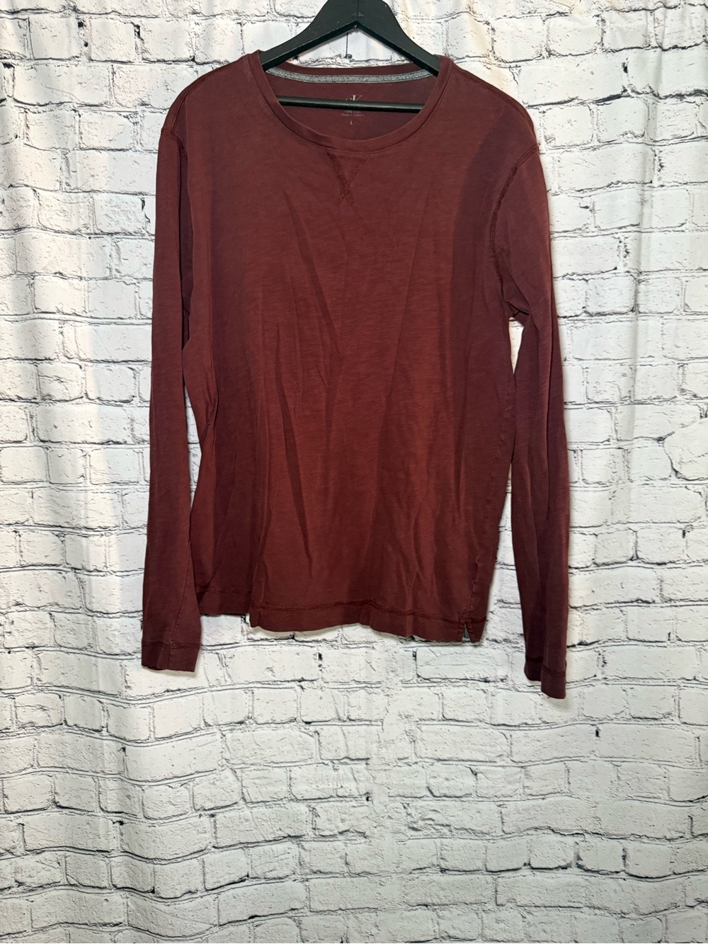 Calvin Klein. Maroon long sleeve. Size L